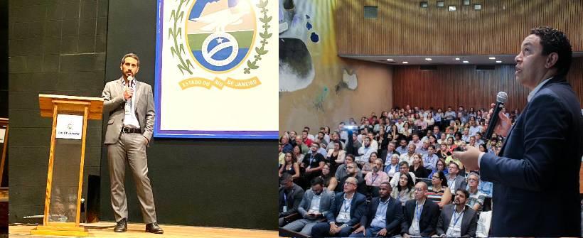 auditório com dezenas de pessoas sentadas 